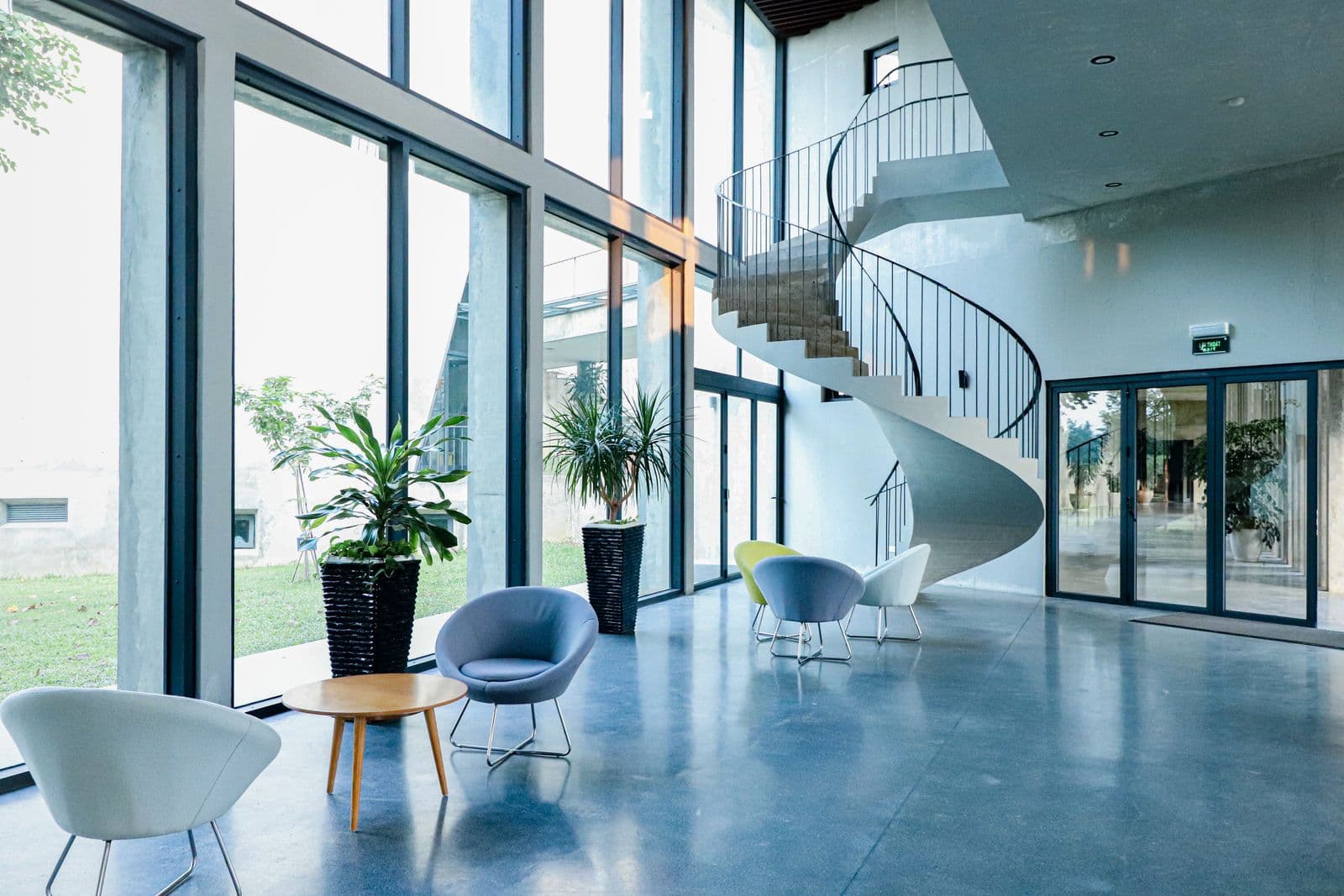 Bright, immaculate office lobby with polished floors and floor-to-ceiling glass